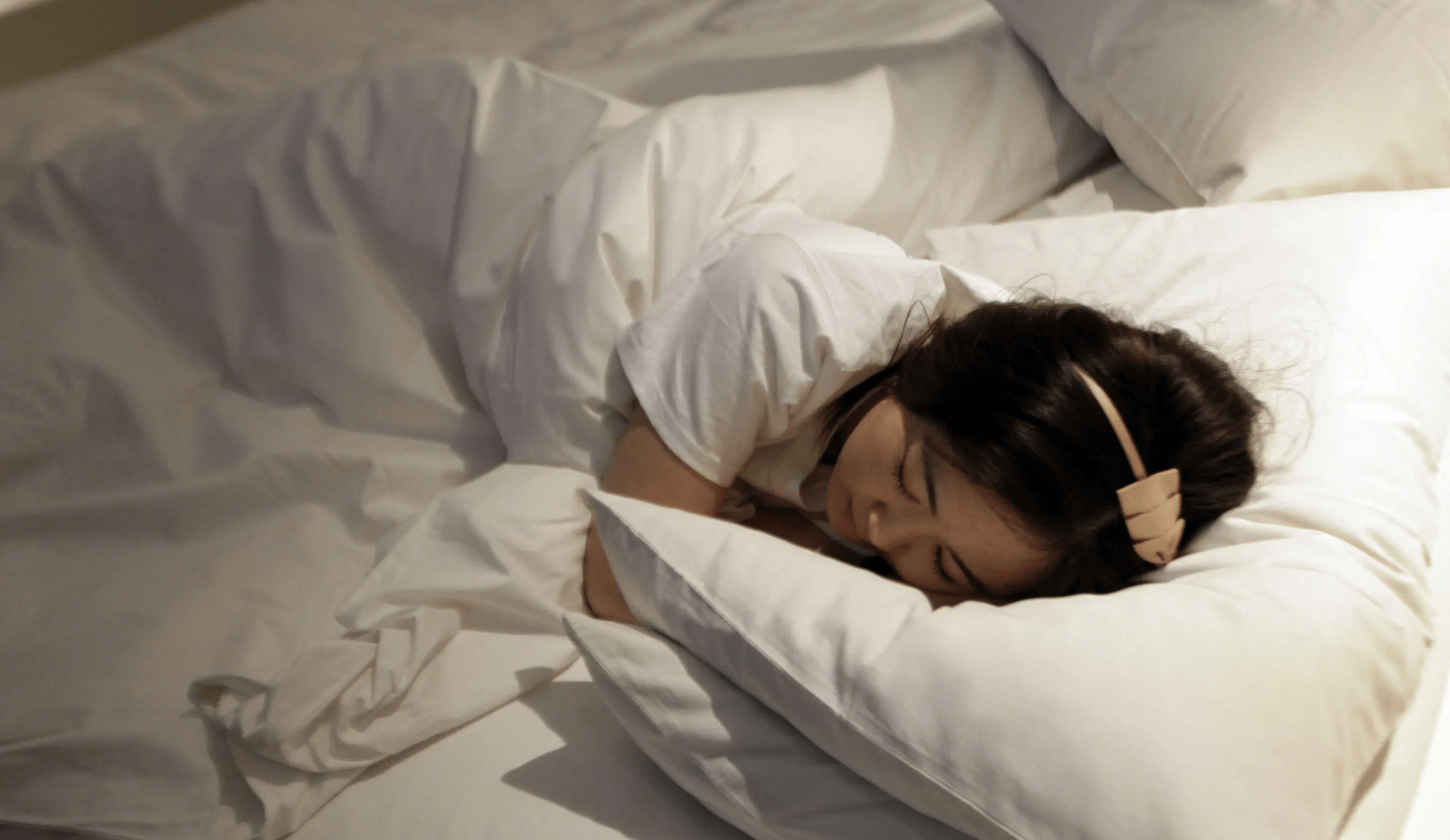 woman-sleeping-quartz-why-8-hours-isnt-enough