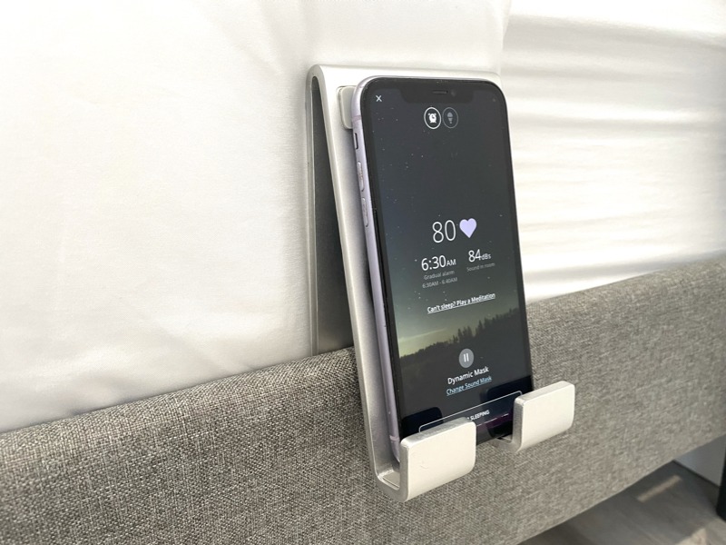 Real-life picture of the SleepSpace Smart Bed and Phone charger playing smart sounds.