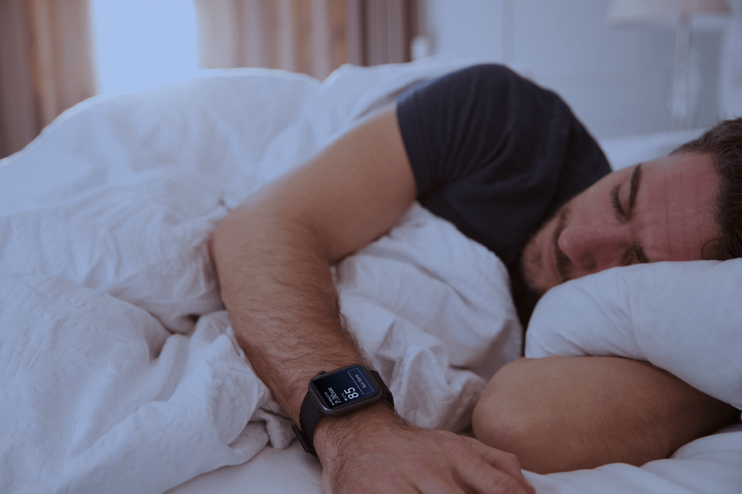 Man sleeping with Apple Watch to more accurately measure sleep stages with SleepSpace high resolution tracking